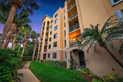 a room with pool table and windows