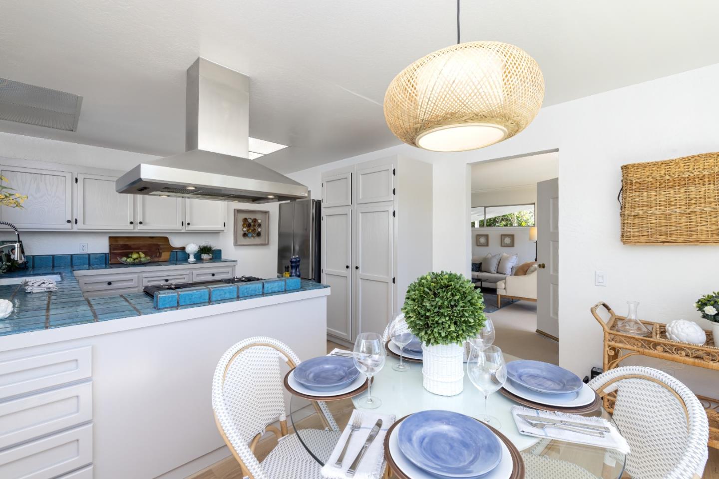 621 Townsend Drive Aptos, CA 95003 - Photo 16 of 43 a kitchen with granite countertop a wooden floor and a potted plant