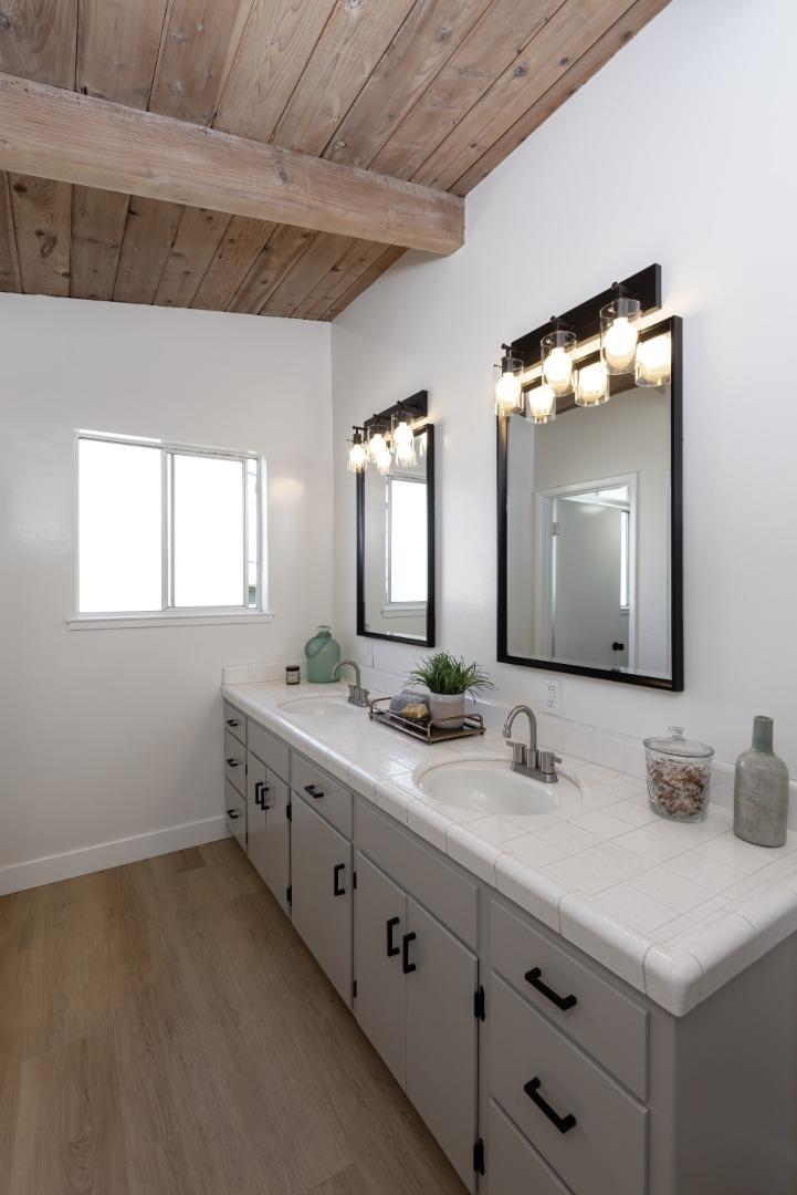 621 Townsend Drive Aptos, CA 95003 - Photo 18 of 43 a bathroom with double sink and a mirror