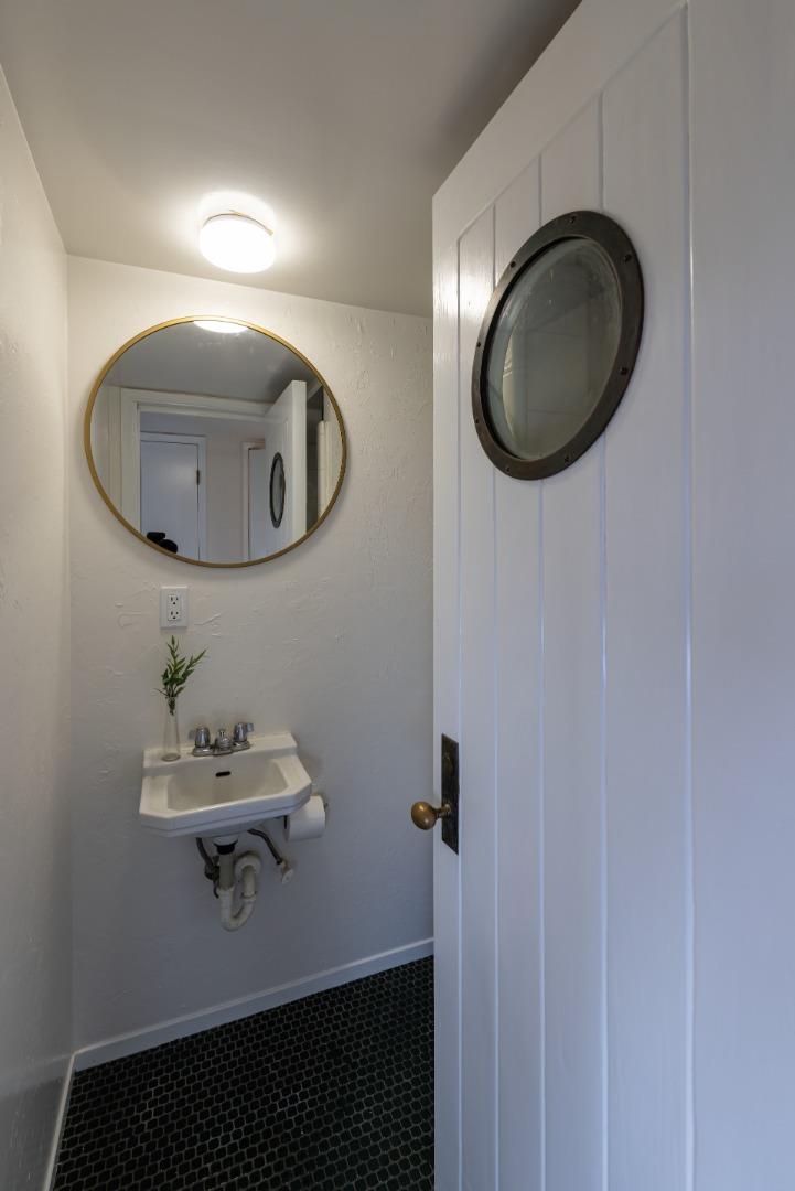 621 Townsend Drive Aptos, CA 95003 - Photo 25 of 43 a bathroom with a sink and a mirror