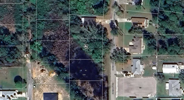 an aerial view of houses with outdoor space