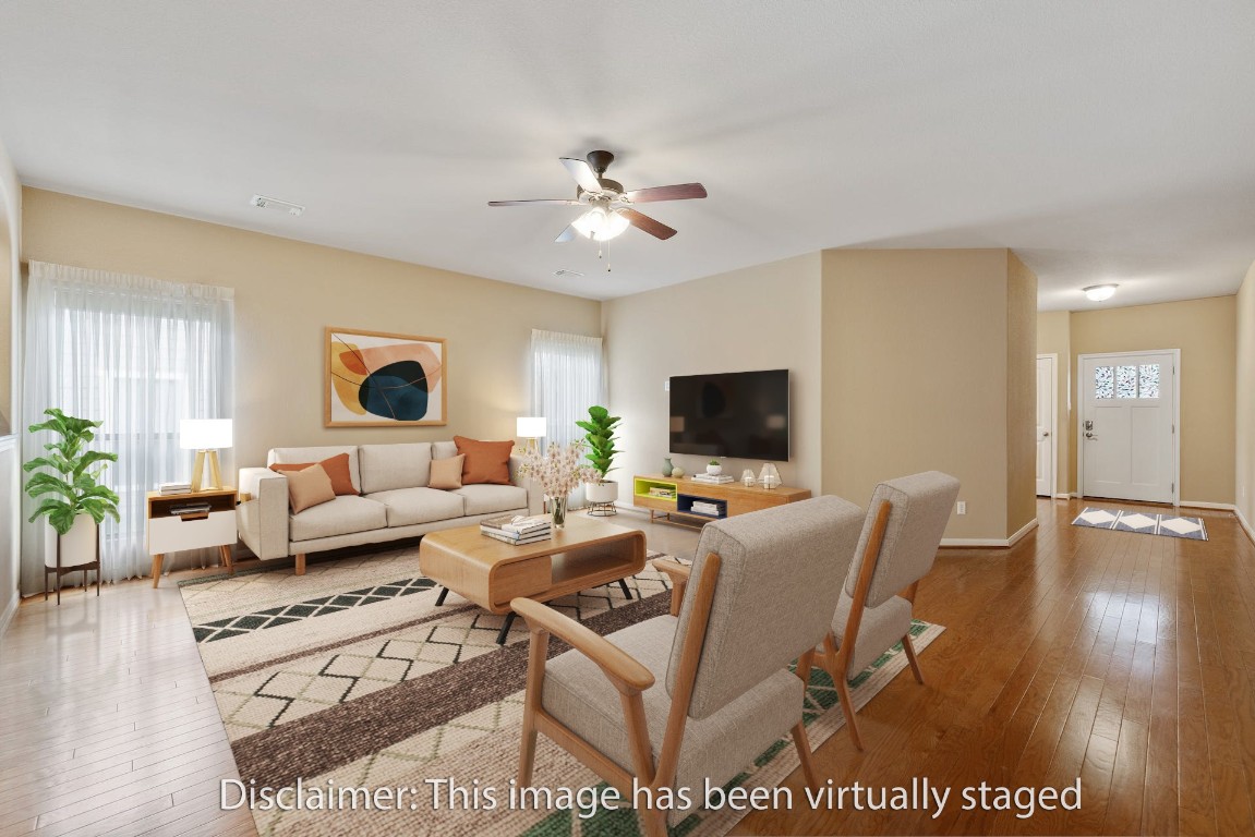 6016 Stone Pass, Unit B89 Austin, TX 78745 - Photo 1 of 1 a living room with furniture or wooden floor and a flat screen tv