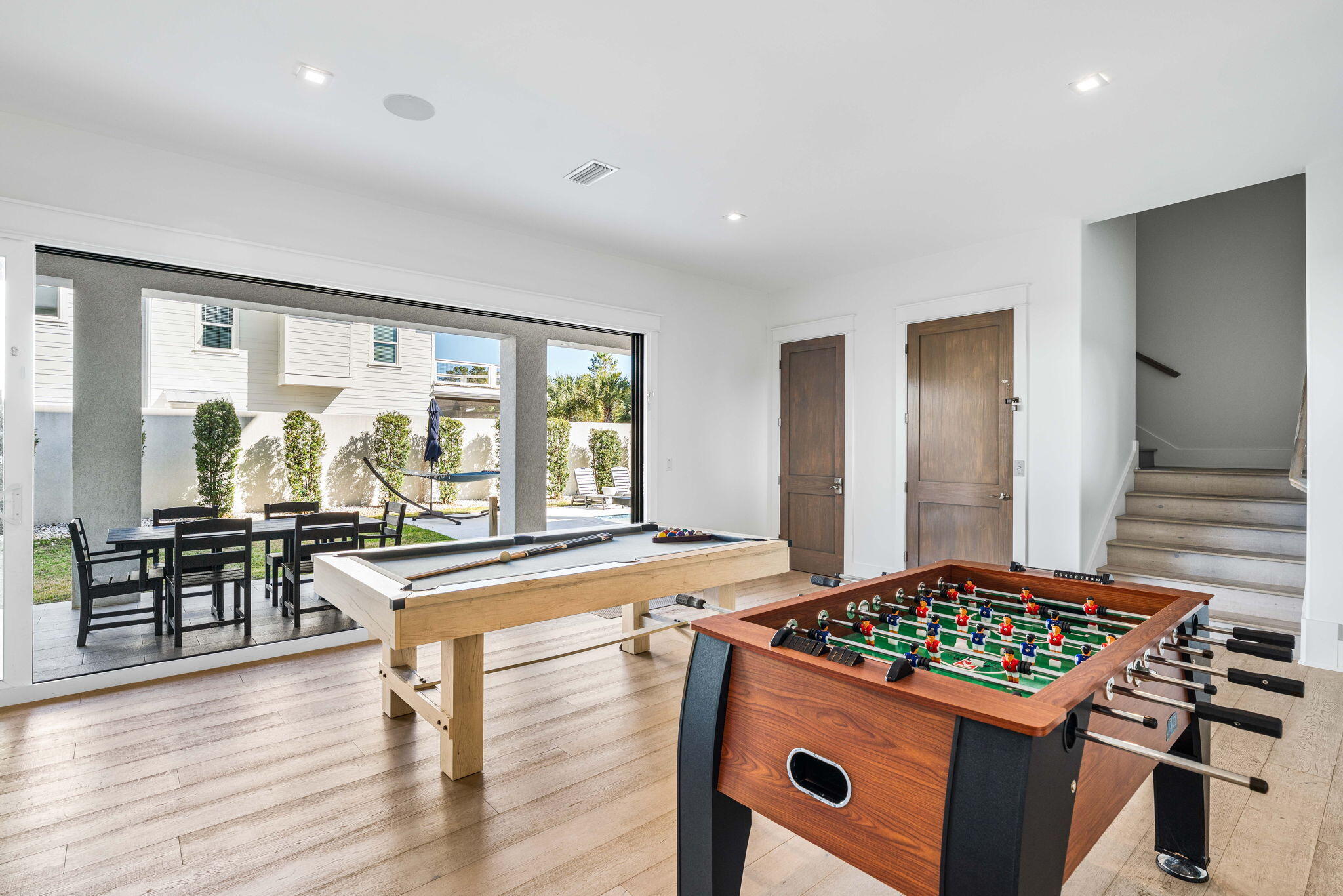 1683 South Co Highway 393 Santa Rosa Beach, FL 32459 - Photo 11 of 72 a kitchen with kitchen island a stove a sink and a dining table view