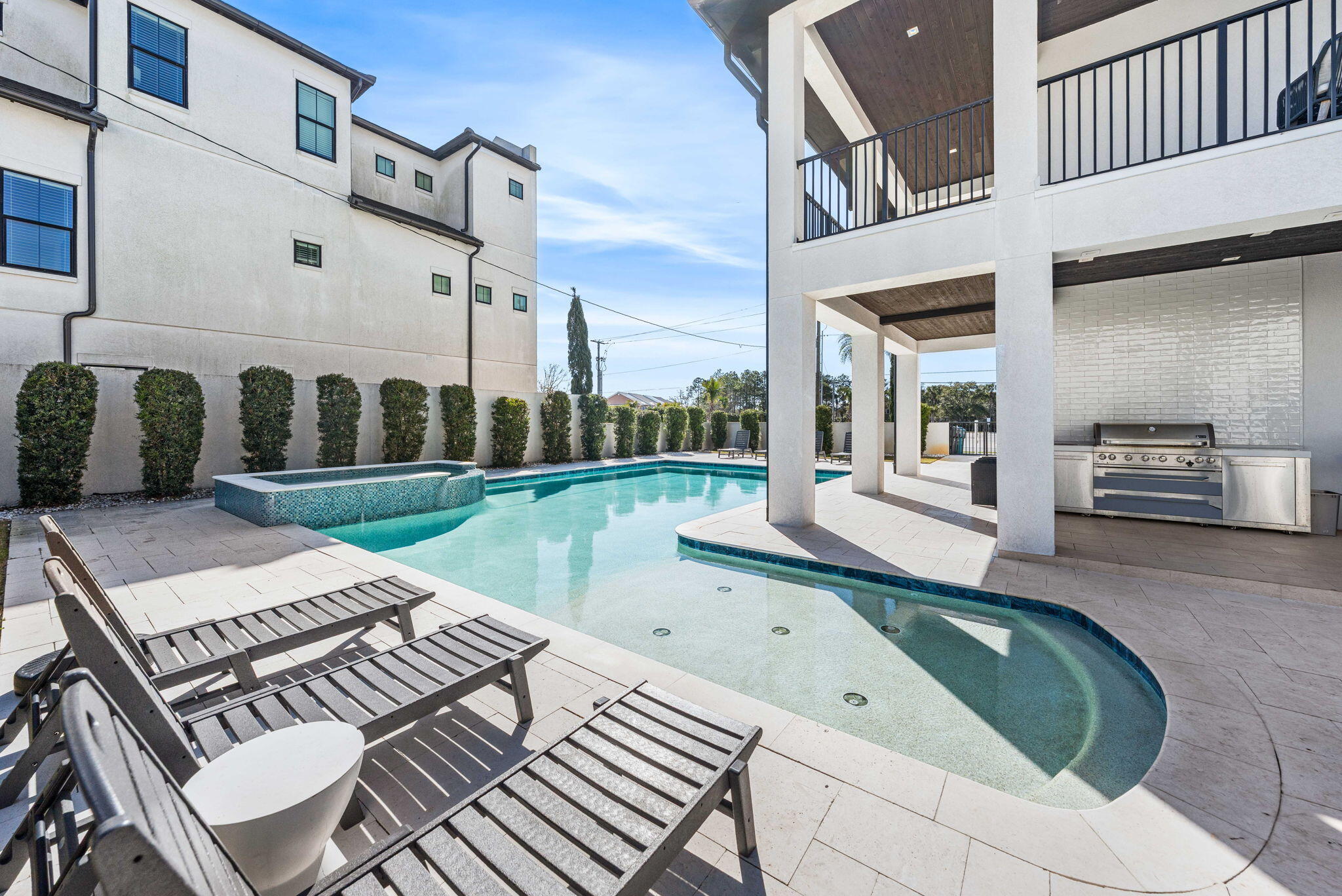1683 South Co Highway 393 Santa Rosa Beach, FL 32459 - Photo 19 of 72 a view of a patio with table and chairs with wooden floor and fence