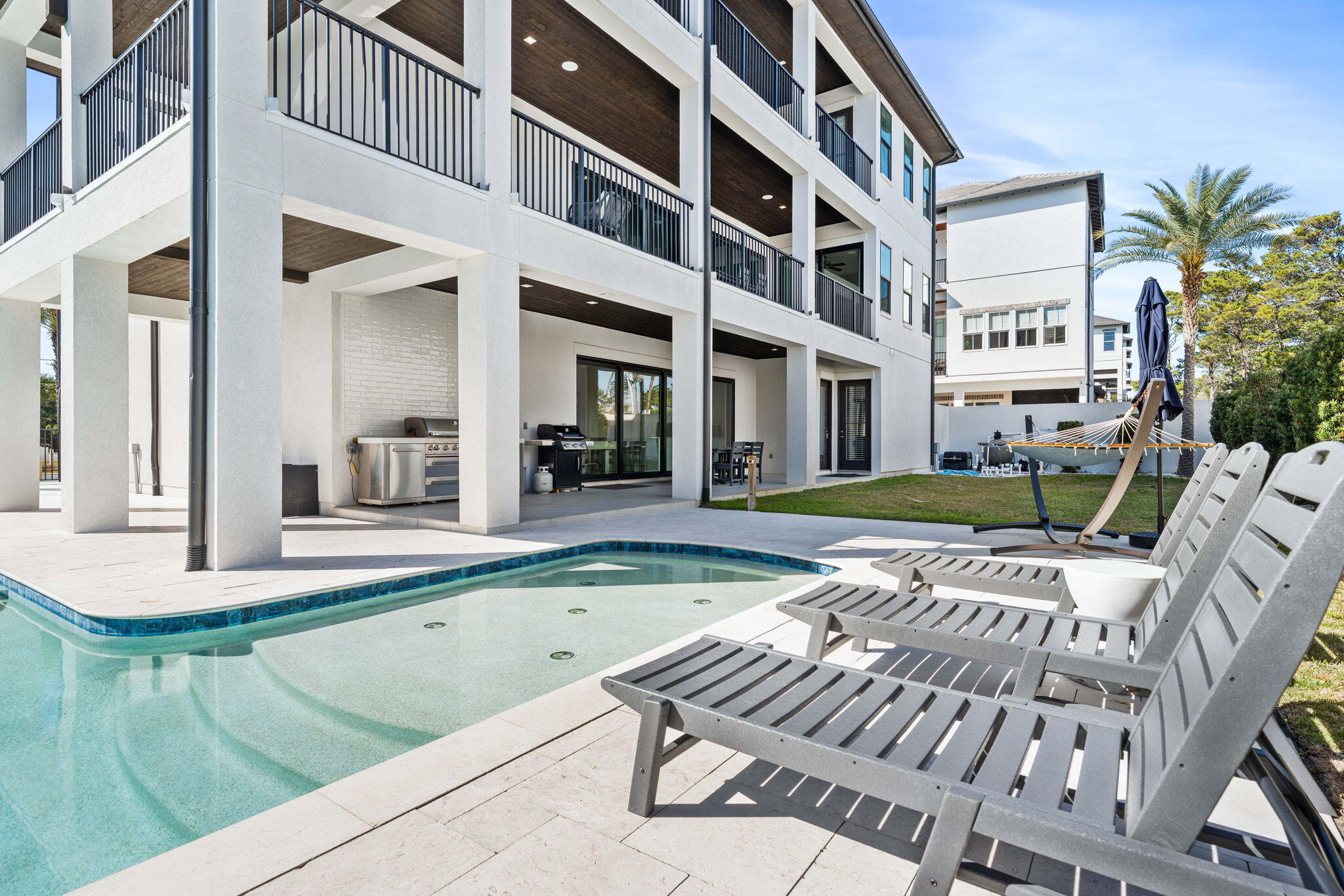 1683 South Co Highway 393 Santa Rosa Beach, FL 32459 - Photo 20 of 72 a view of an house with backyard and swimming pool