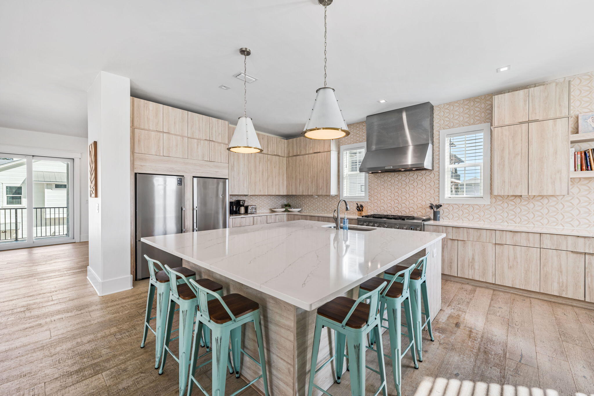 1683 South Co Highway 393 Santa Rosa Beach, FL 32459 - Photo 33 of 72 a open kitchen with stainless steel appliances granite countertop a kitchen island a stove a table and chairs