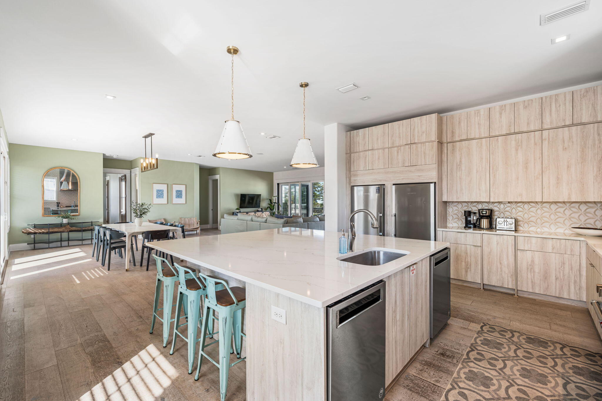1683 South Co Highway 393 Santa Rosa Beach, FL 32459 - Photo 35 of 72 a very nice looking kitchen with kitchen island a stove a sink a dining table and chairs with wooden floor