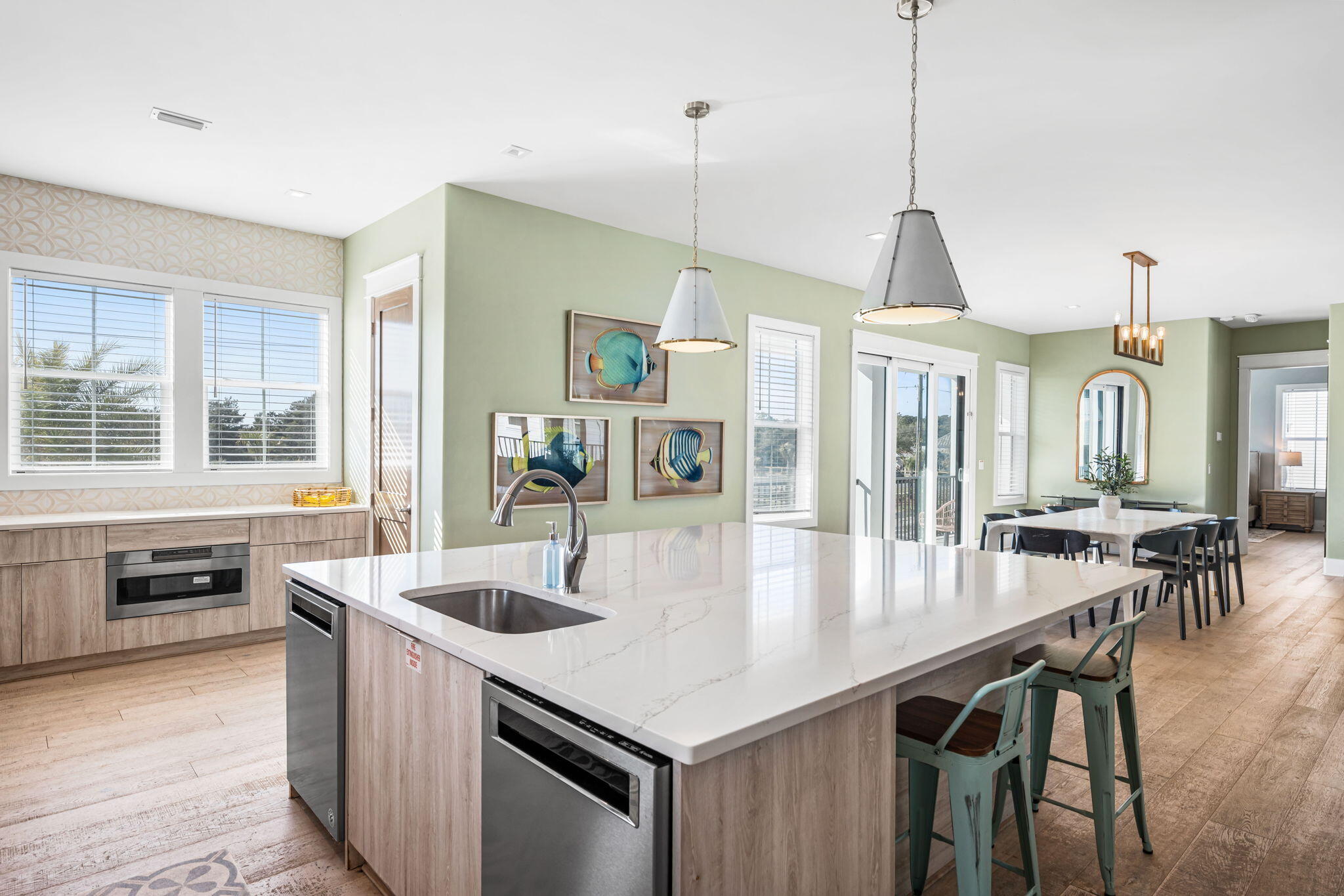 1683 South Co Highway 393 Santa Rosa Beach, FL 32459 - Photo 36 of 72 a kitchen with stainless steel appliances granite countertop a kitchen island a stove a table and chairs
