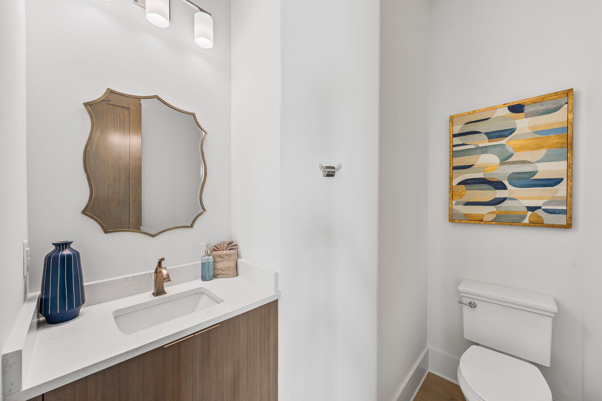 1683 South Co Highway 393 Santa Rosa Beach, FL 32459 - Photo 39 of 72 a bathroom with a toilet sink and mirror