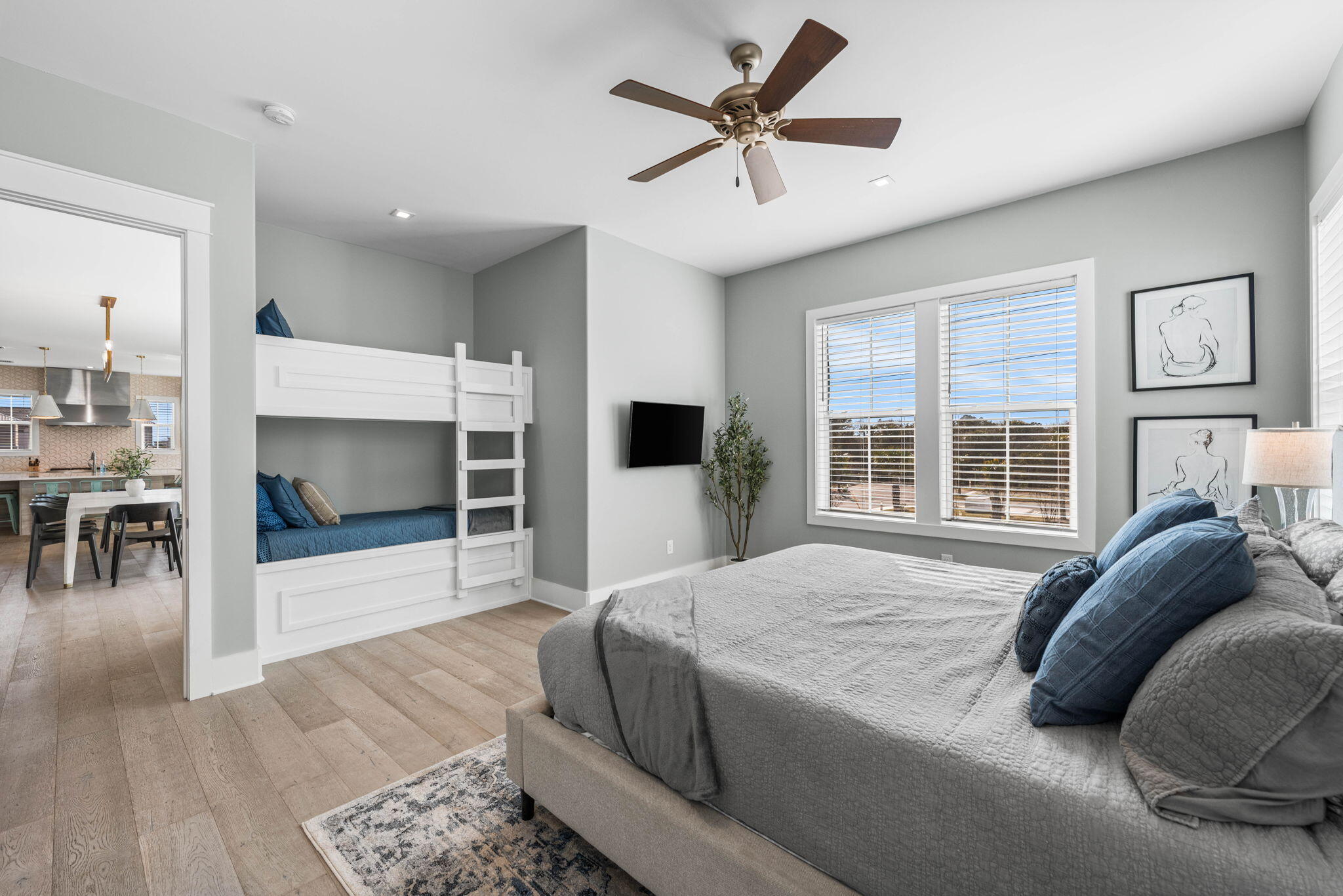 1683 South Co Highway 393 Santa Rosa Beach, FL 32459 - Photo 41 of 72 a spacious bedroom with a bed a fireplace and a large window