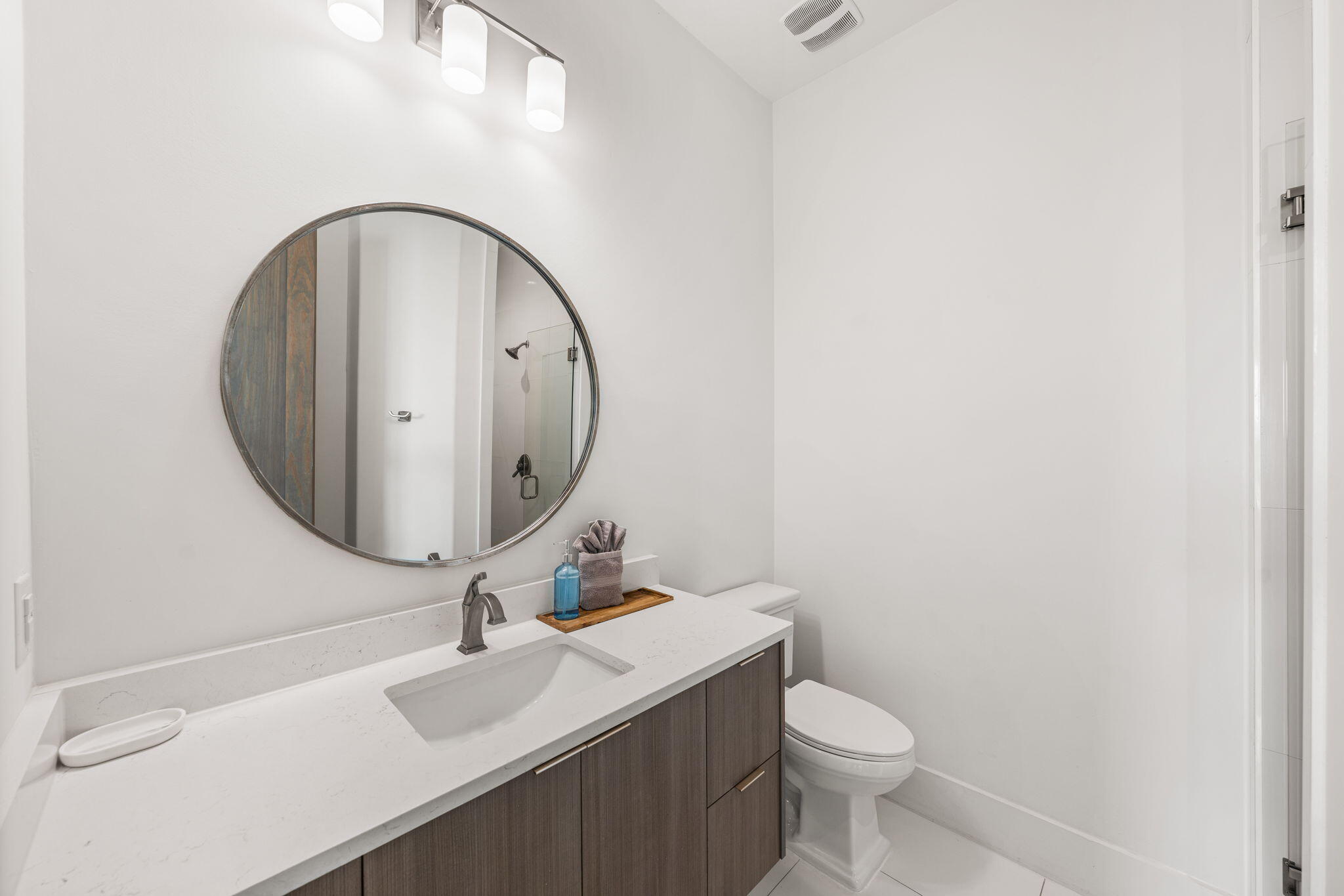 1683 South Co Highway 393 Santa Rosa Beach, FL 32459 - Photo 42 of 72 a bathroom with a toilet sink and mirror