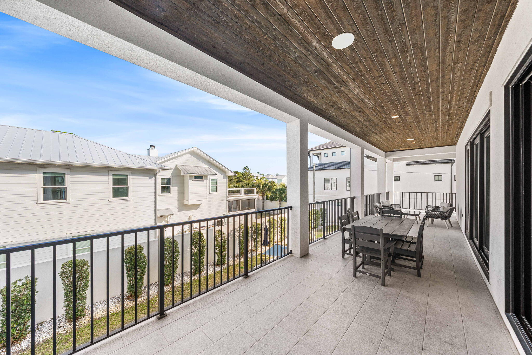 1683 South Co Highway 393 Santa Rosa Beach, FL 32459 - Photo 44 of 72 a view of a chair and tables in the balcony