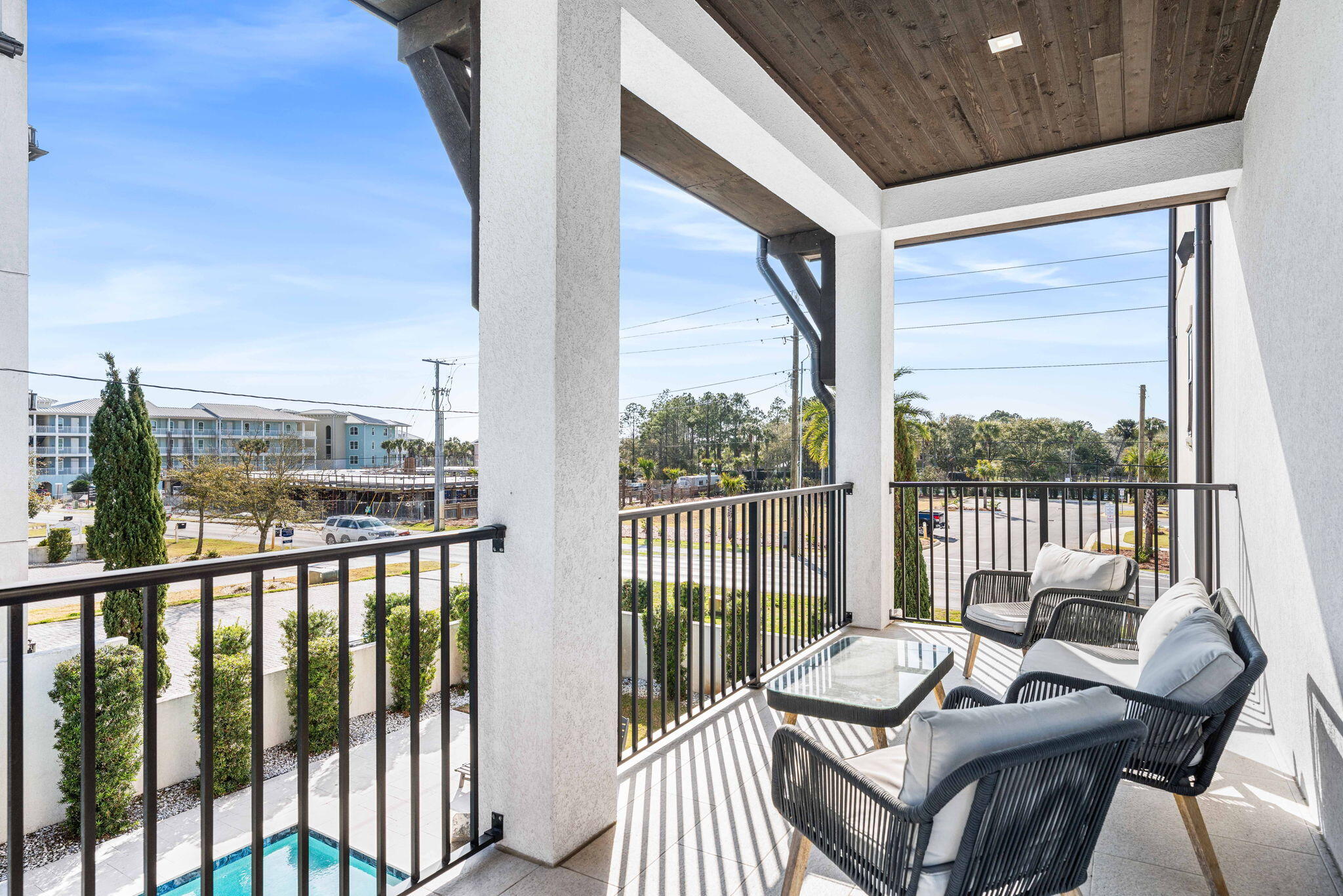 1683 South Co Highway 393 Santa Rosa Beach, FL 32459 - Photo 47 of 72 a view of a balcony with chair and wooden floor
