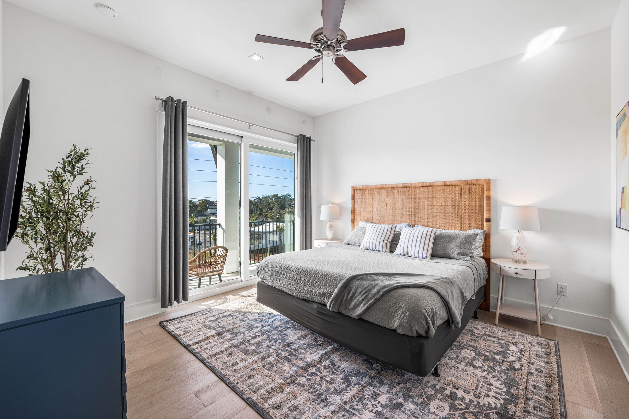 1683 South Co Highway 393 Santa Rosa Beach, FL 32459 - Photo 51 of 72 a bedroom with a large bed and a chandelier