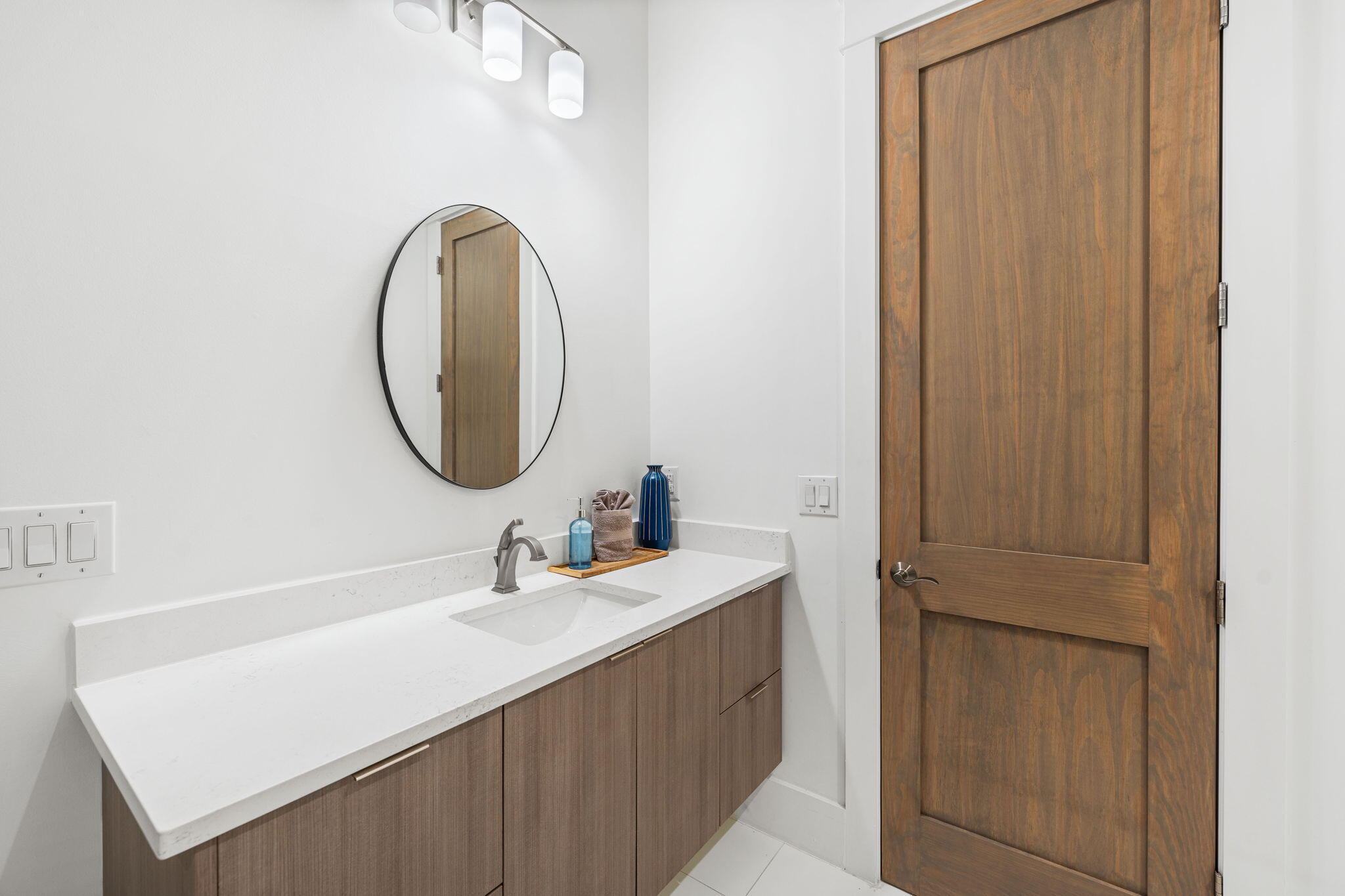 1683 South Co Highway 393 Santa Rosa Beach, FL 32459 - Photo 53 of 72 a bathroom with a sink vanity and a mirror