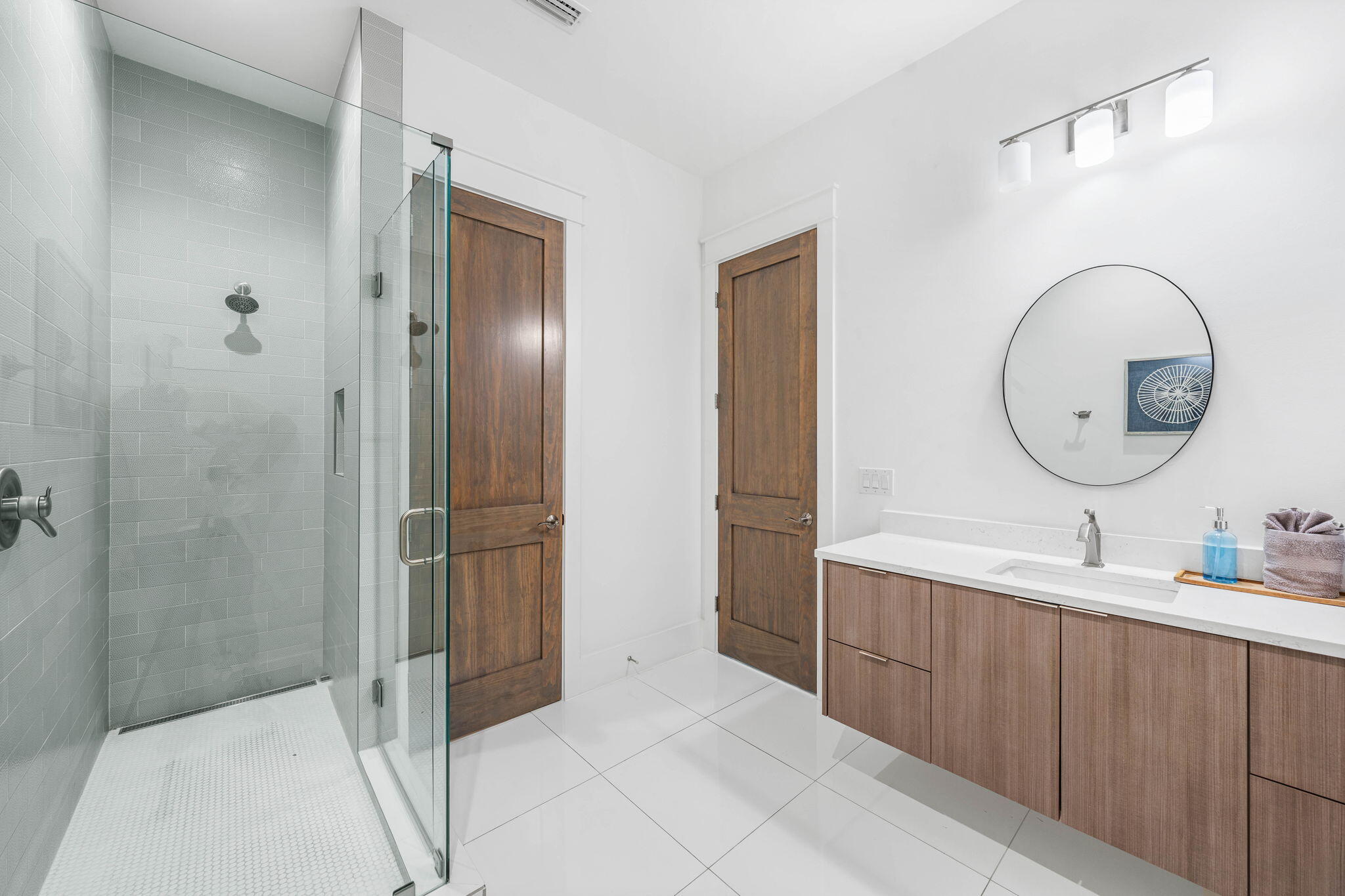 1683 South Co Highway 393 Santa Rosa Beach, FL 32459 - Photo 54 of 72 a bathroom with a double vanity sink mirror and shower