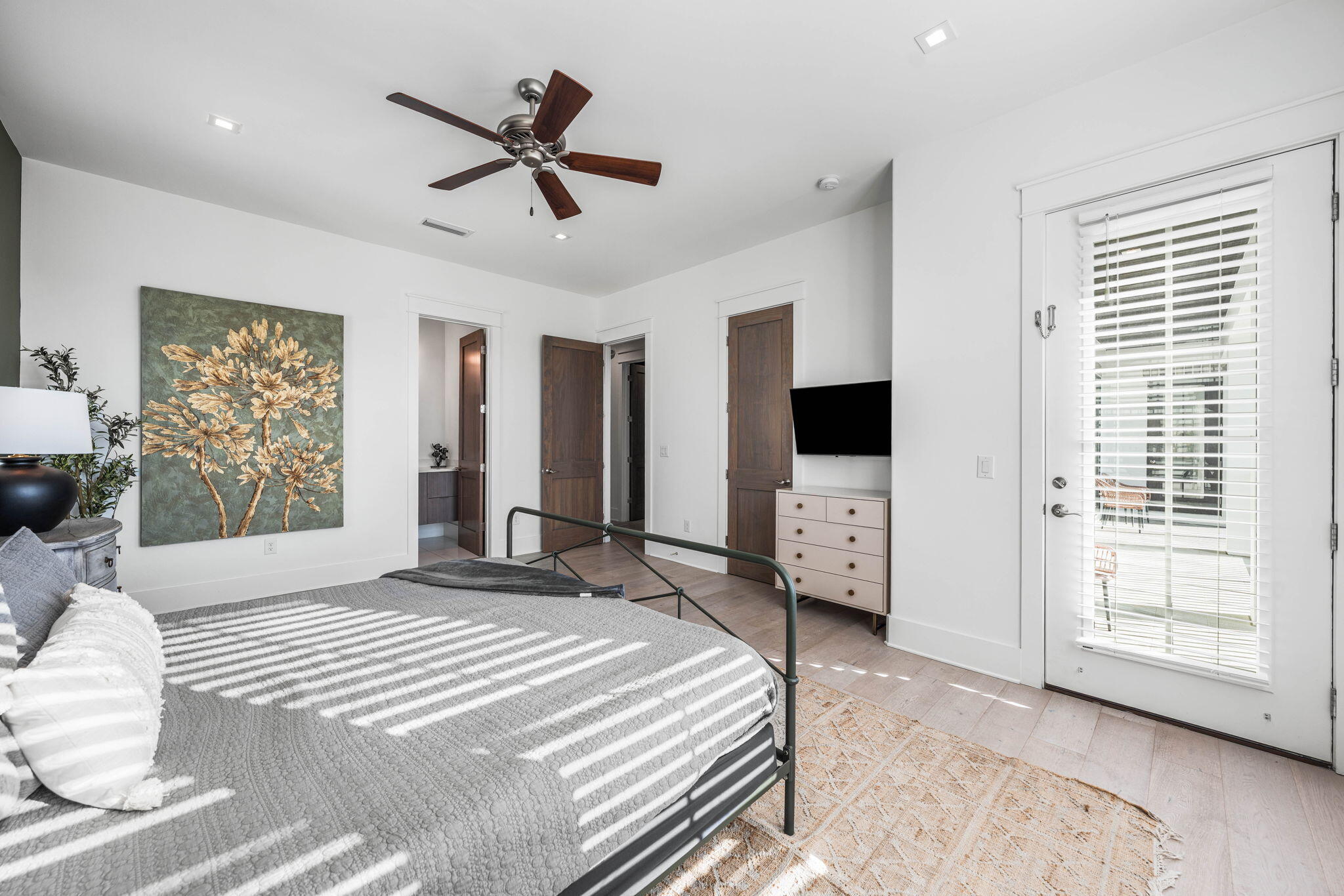 1683 South Co Highway 393 Santa Rosa Beach, FL 32459 - Photo 67 of 72 a bedroom with a bed a large window and a chandelier