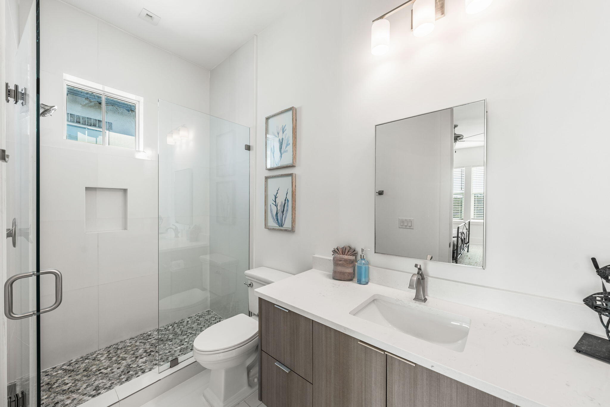 1683 South Co Highway 393 Santa Rosa Beach, FL 32459 - Photo 68 of 72 a bathroom with a sink toilet and shower