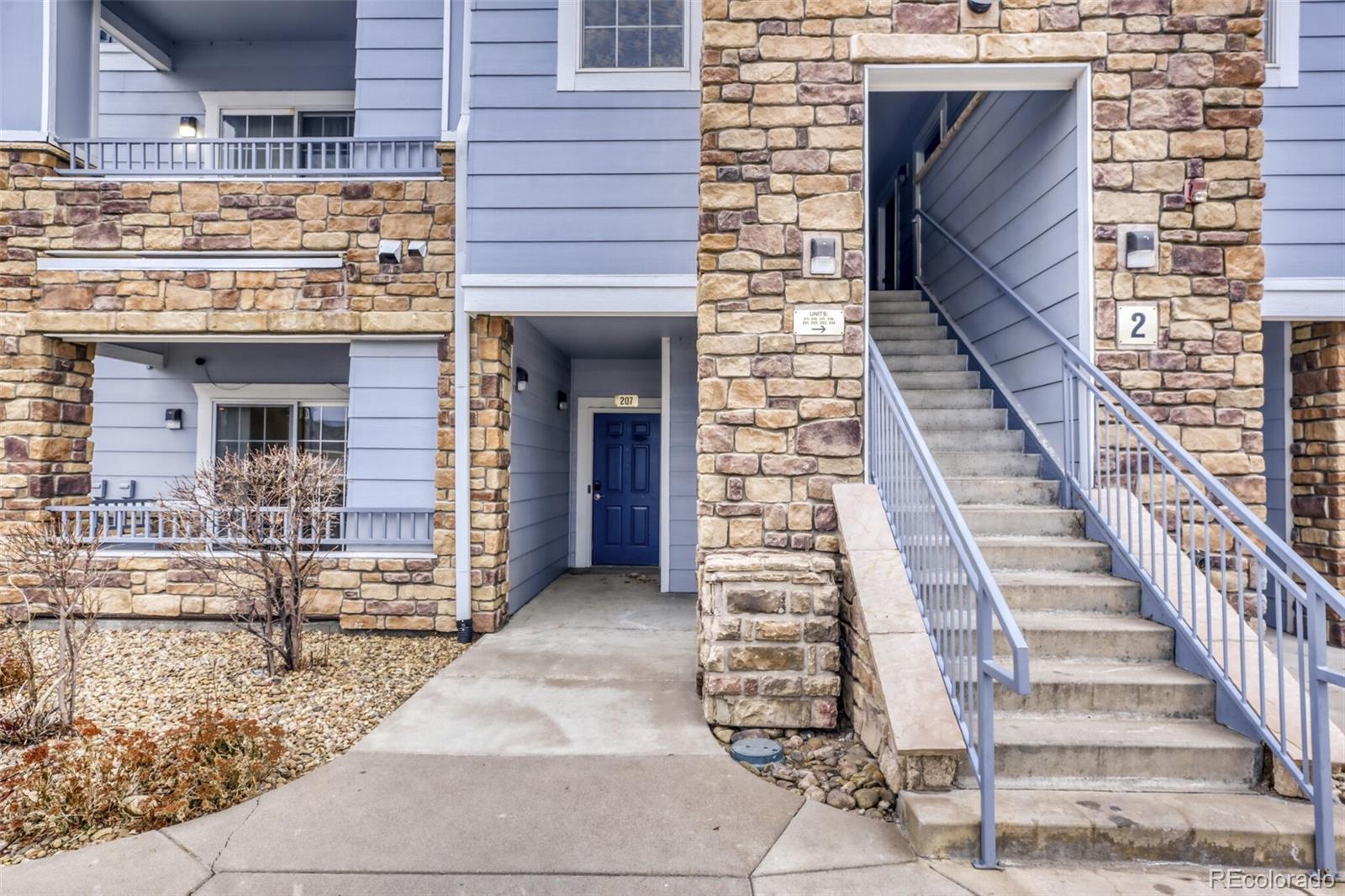 5255 Memphis Street, Unit 207 Denver, CO 80239 - Photo 2 of 21 a view of a brick house with wooden floor and windows