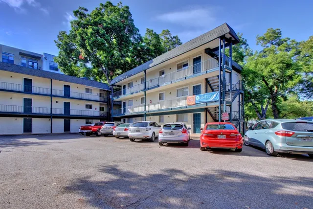 a bathroom with a double vanity sink mirror and toilet