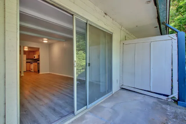 a view of a house with swimming pool and sitting area