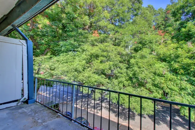 a outdoor sitting area with furniture and wooden floor