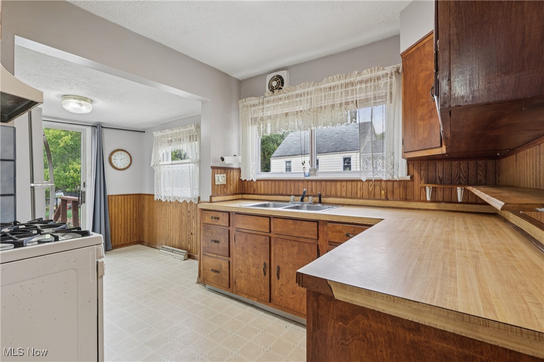 1674 Betz Road Akron, OH 44306 - Photo 10 of 29 Kitchen with a sink, cupboards, stove and eating area