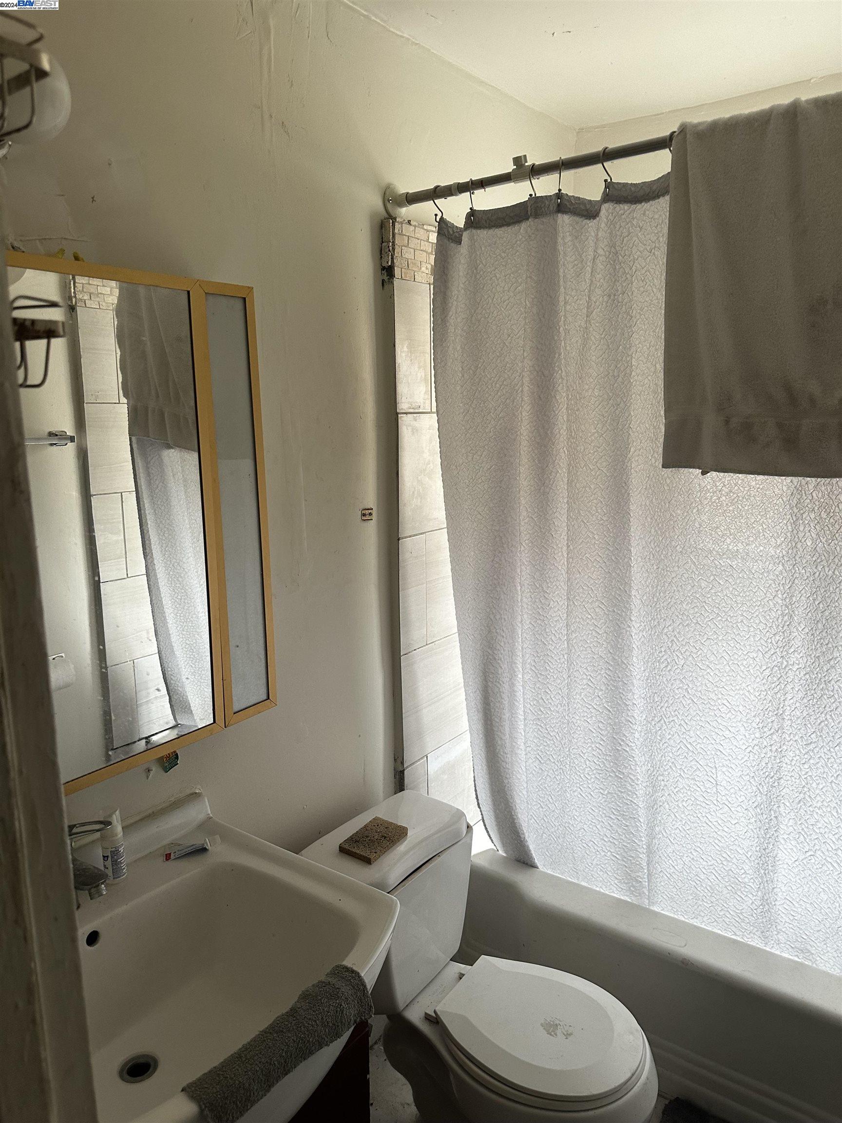 5659 Telegraph Avenue Oakland, CA 94609 - Photo 33 of 42 a bathroom with a sink and a mirror