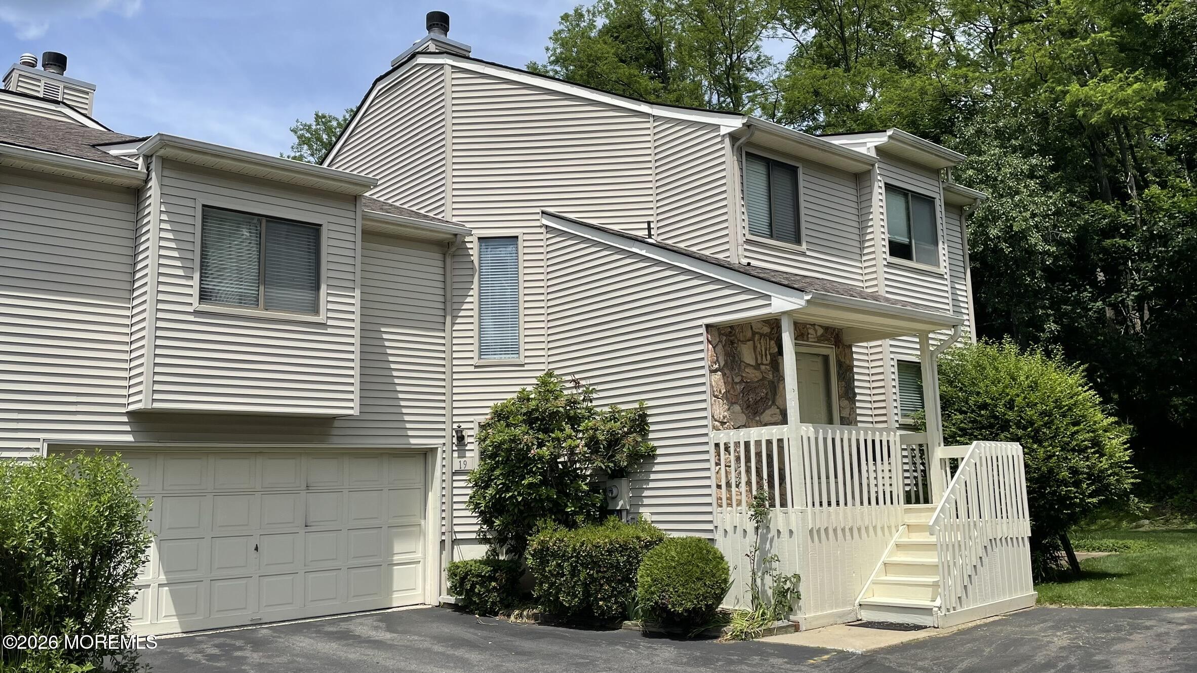 19 Clavendon Court Middletown, NJ 07748 - Photo 1 of 21 a view of a house with a garage