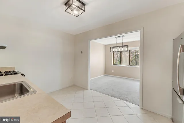 a view of a kitchen with a sink cabinets and a window