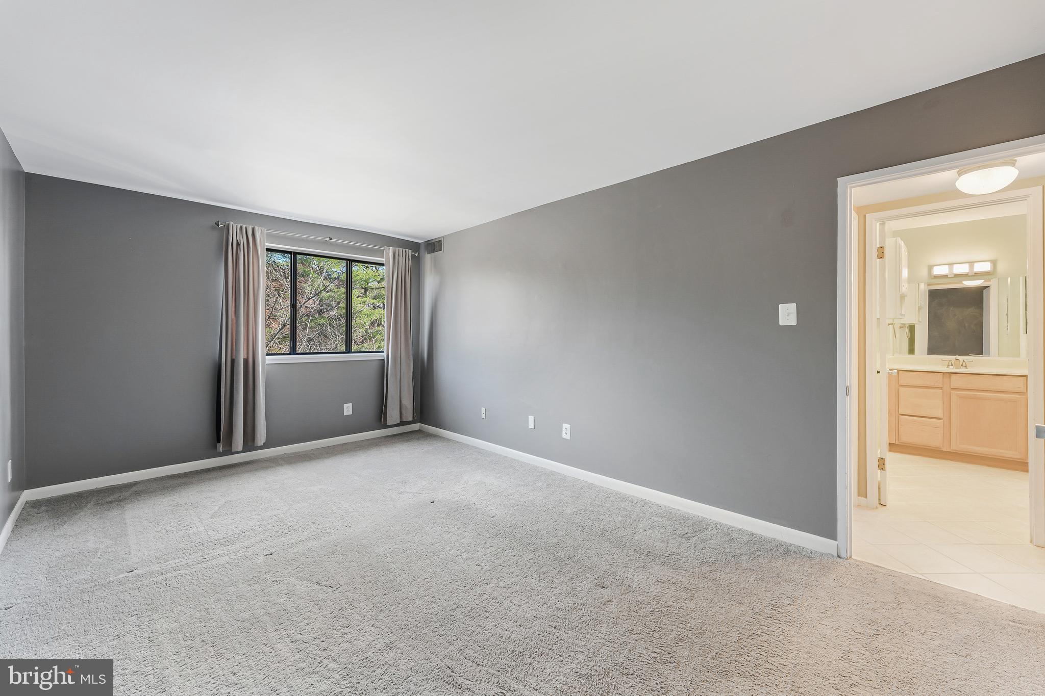 1623 Parkcrest Circle, Unit 9B/300 Reston, VA 20190 - Photo 18 of 32 a view of an empty room with a window