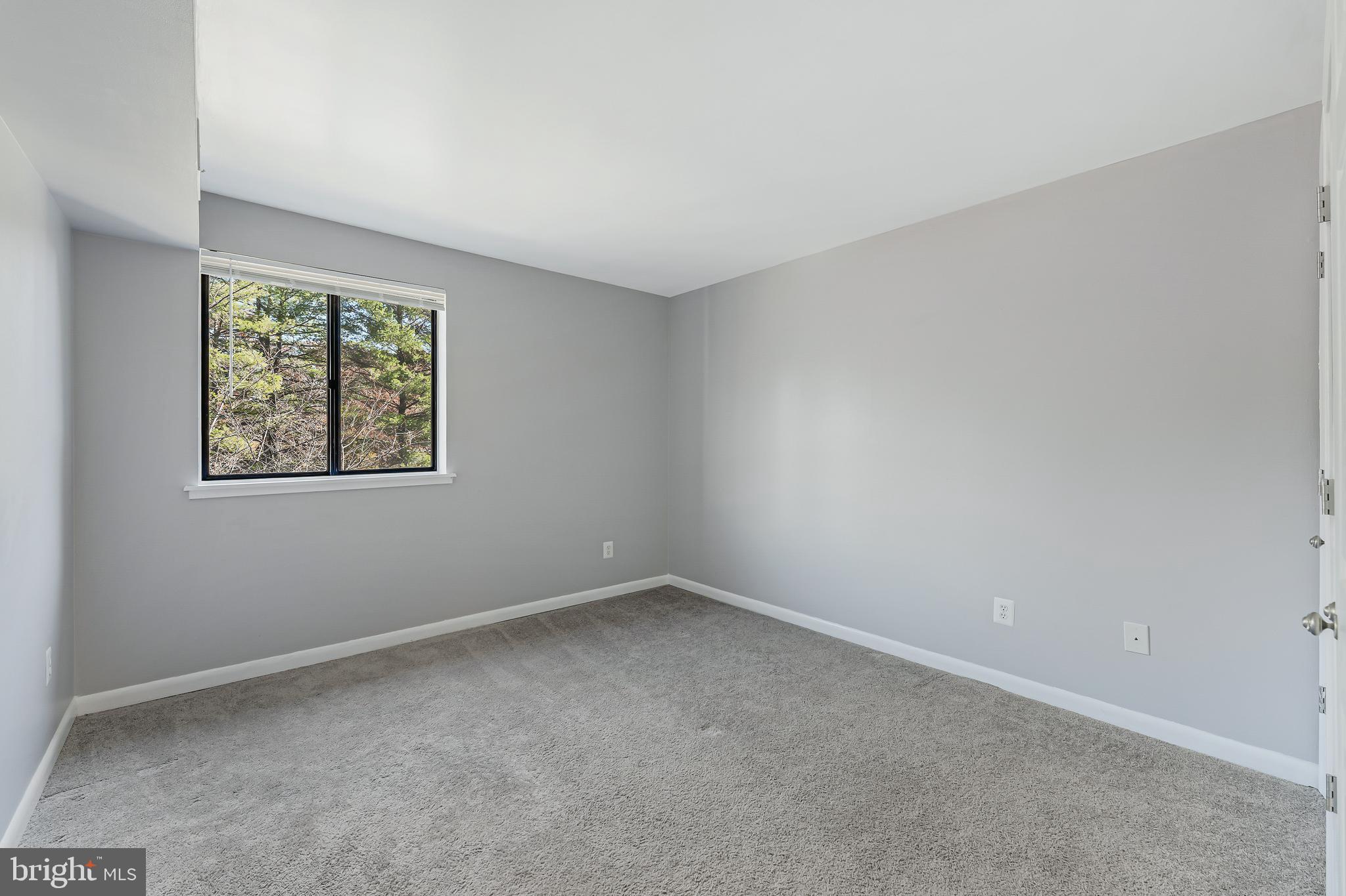 1623 Parkcrest Circle, Unit 9B/300 Reston, VA 20190 - Photo 20 of 32 an empty room with a window