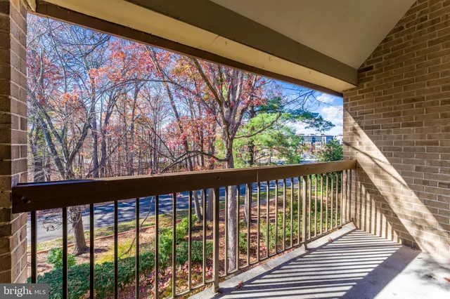 a view of a balcony with wooden floor