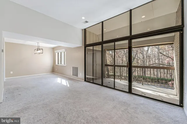 a view of an empty room with windows