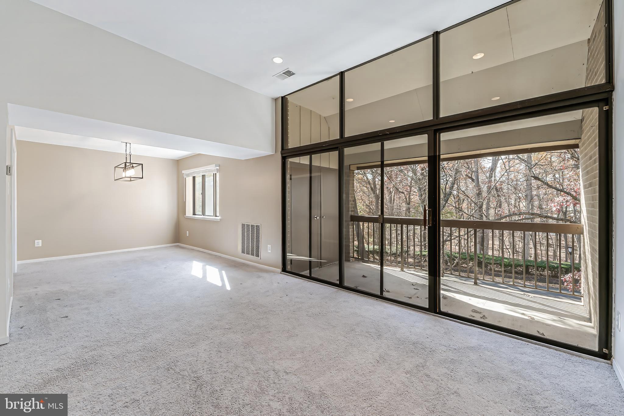 1623 Parkcrest Circle, Unit 9B/300 Reston, VA 20190 - Photo 7 of 32 a view of an empty room with windows