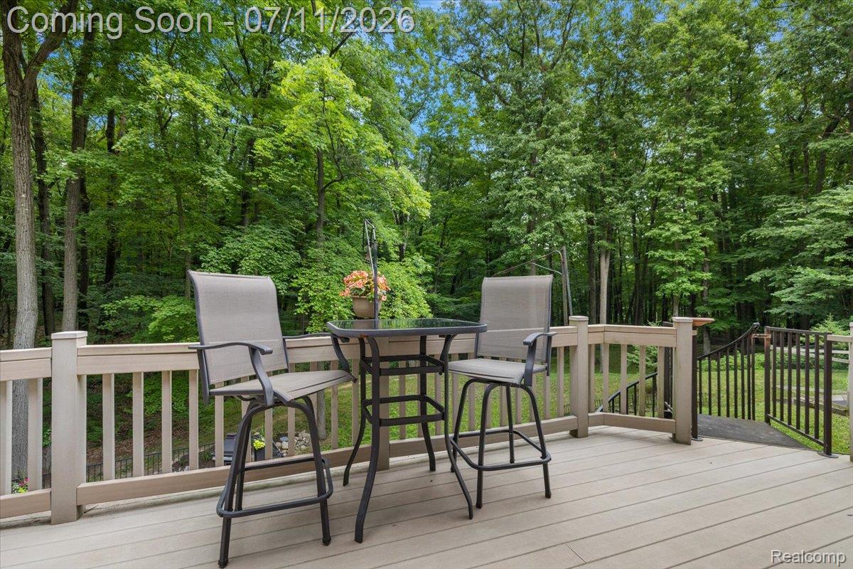 4219 Gardner Road Metamora, MI 48455 - Photo 68 of 87 Expansive composite deck featuring a light-toned surface and a matching railing system