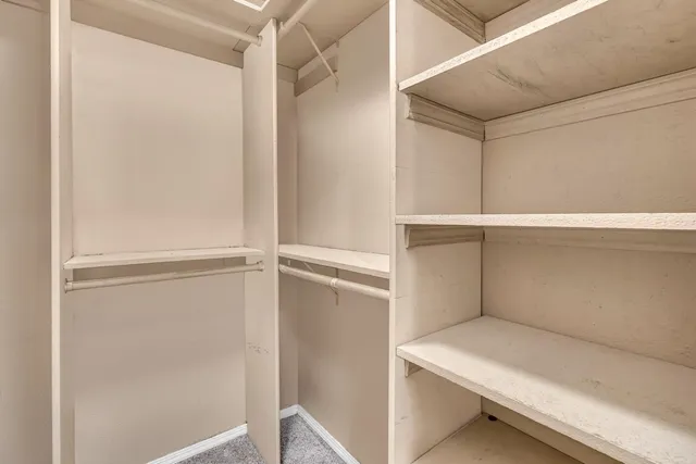 a view of an empty walk in closet