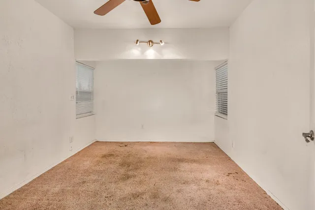 an empty room with cabinet and projector