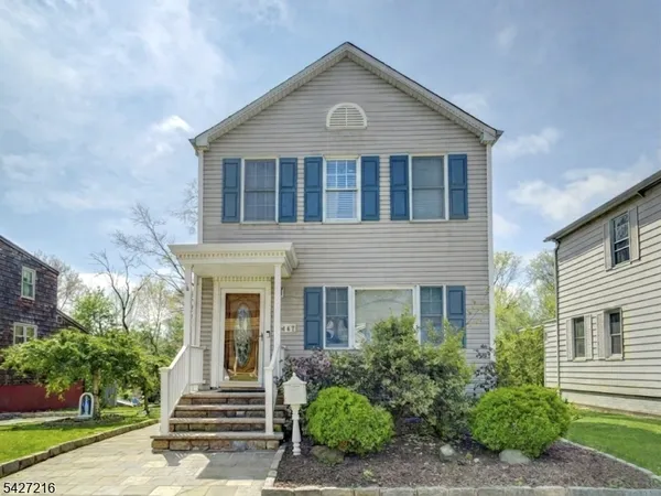 front view of a house with a small yard