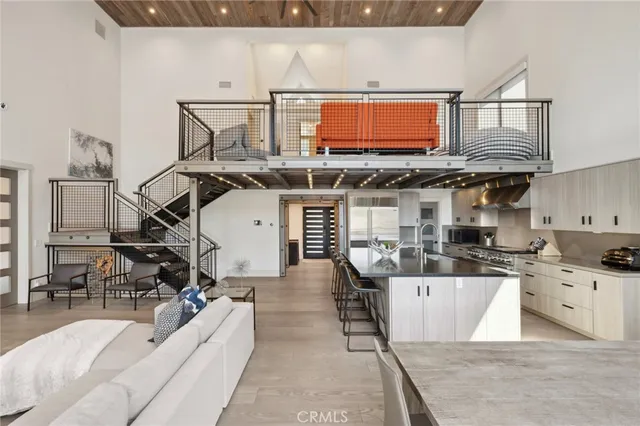 a kitchen with stainless steel appliances granite countertop a sink dishwasher stove top oven and cabinets