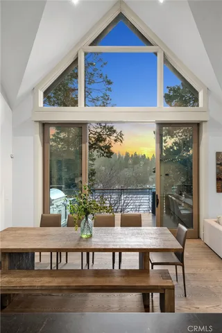 a view of a chairs and table in the balcony