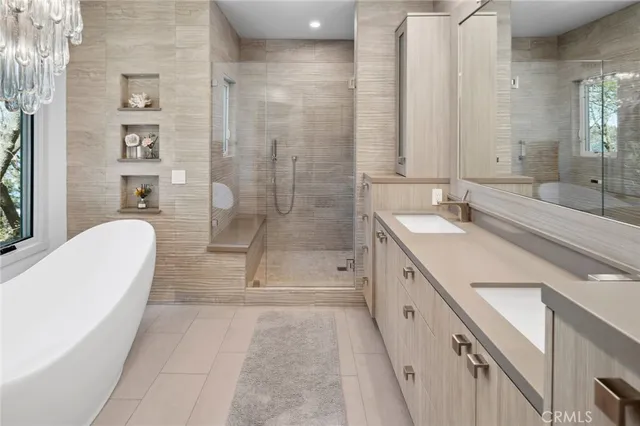 a spacious bathroom with a granite countertop sink a toilet a mirror and shower