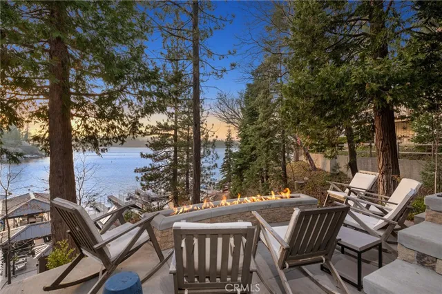 a view of a patio with table and chairs and couches