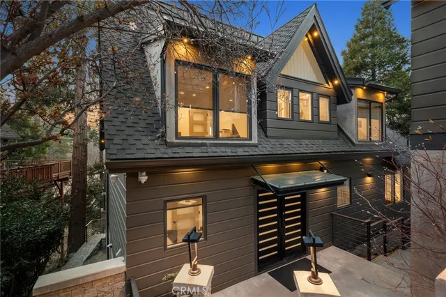 front view of a house with a wooden deck