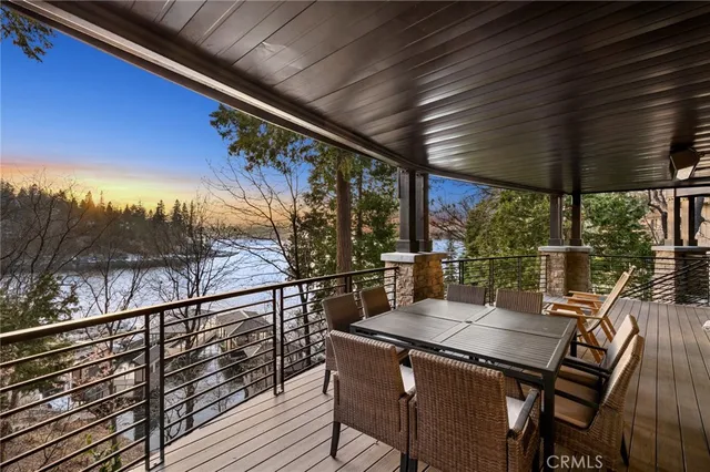 a view of a chairs and table in the balcony