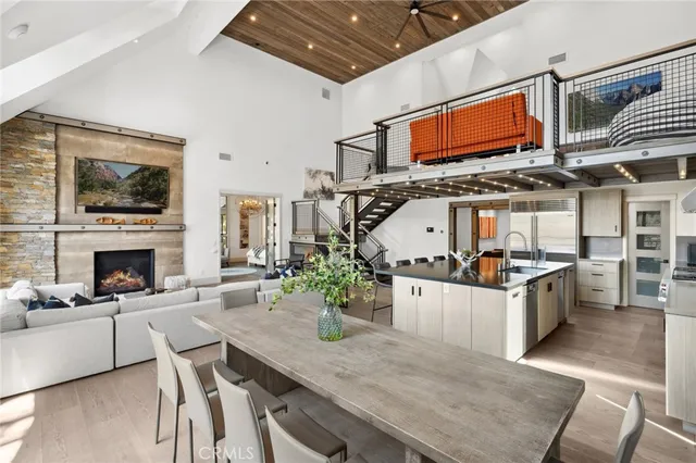 a kitchen with stainless steel appliances kitchen island granite countertop a stove and cabinets