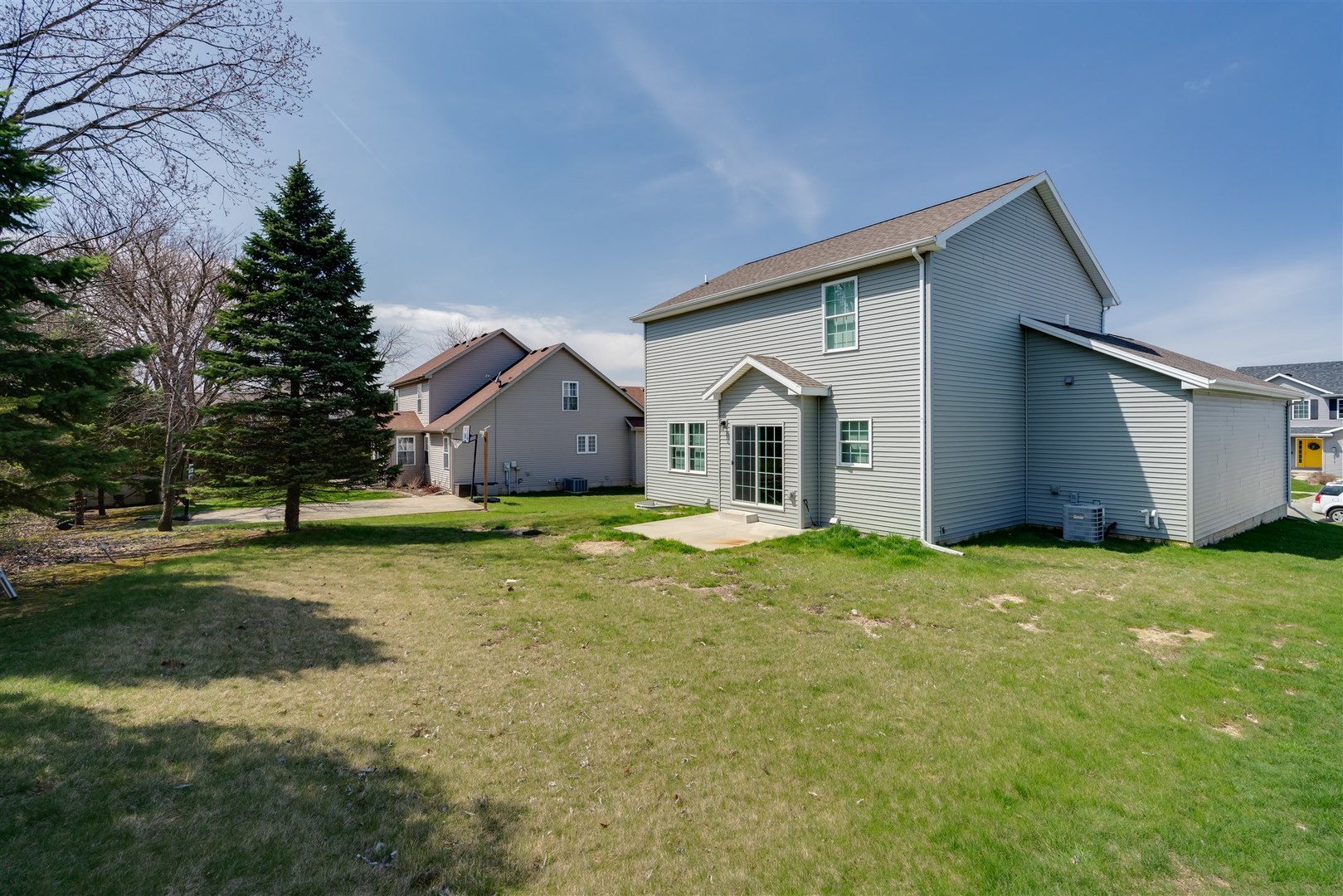 2514 Grey Fox Trail Bloomington, IL 61705 - Photo 36 of 37 a view of a white house with a yard