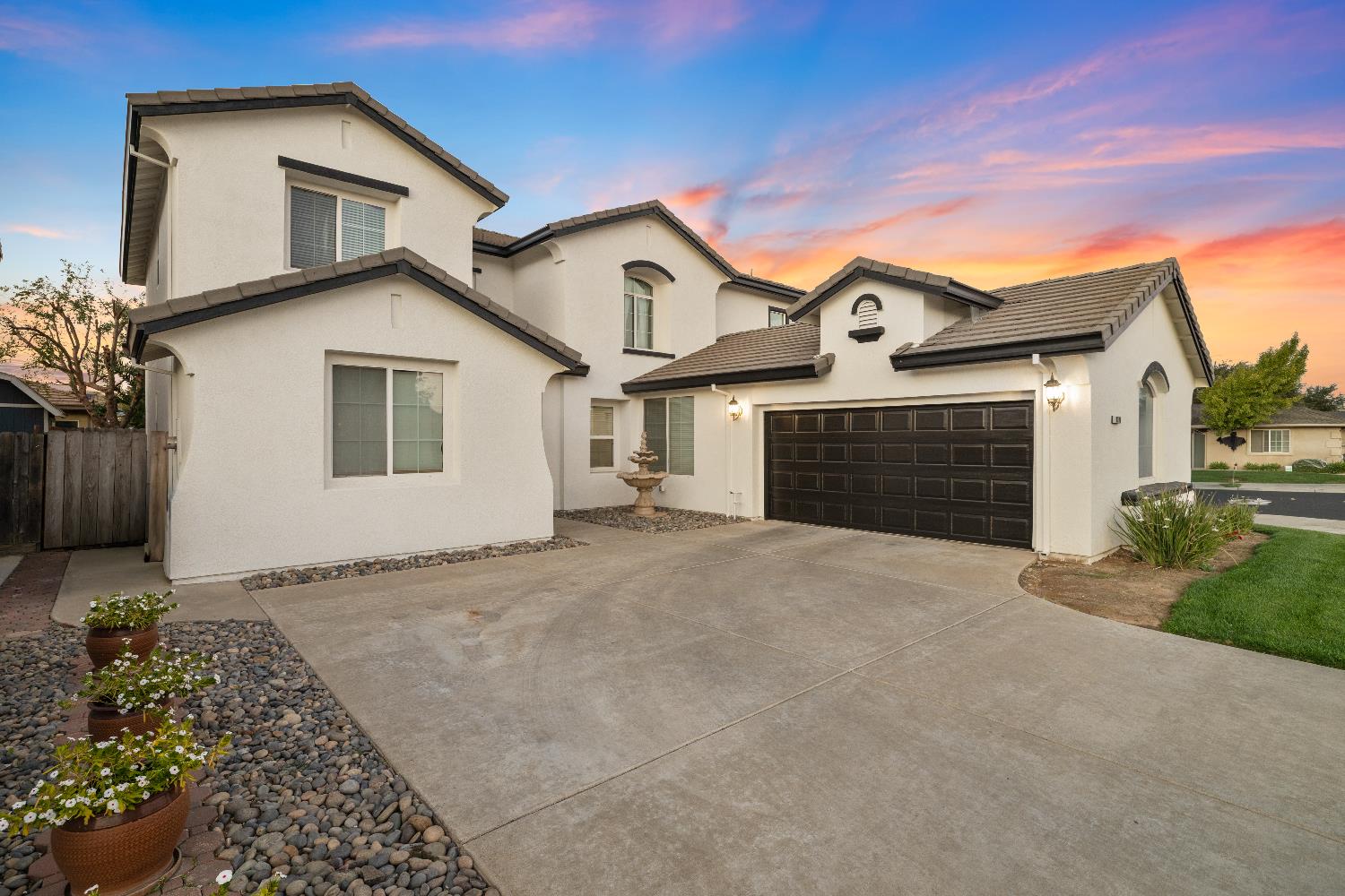 2775 Glow Road Riverbank, CA 95367 - Photo 1 of 1 a front view of a house with a yard and garage