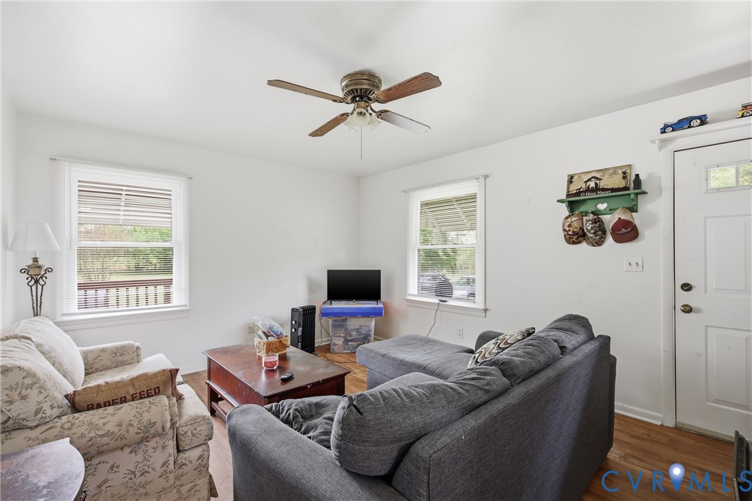 3590 Belle Meade Road Bumpass, VA 23024 - Photo 5 of 20 a living room with furniture and a flat screen tv