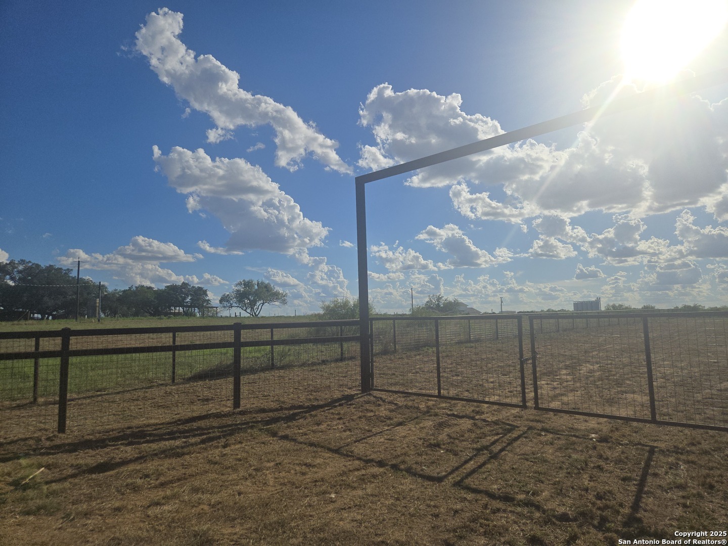 15215 Cassiano Road Elmendorf, TX 78112 - Photo 3 of 7 a view of a back yard